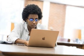 Student at computer in library