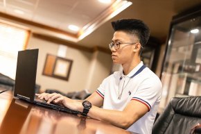 Ringo Nguyen working at a computer