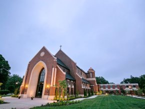 Grace Chapel is shown with the outdoor lights on in the evening