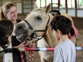 Rising Hope Farms students and volunteer with horse