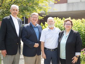 Andy Anderson, Fred Whitt, Robert Fritz and Jennifer Burris together on campus