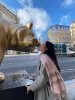 Kenzie Foyle with a bear statue in Paris