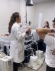 Kabre Heck demonstrates mass spectrometry equipment for pharmacy students.