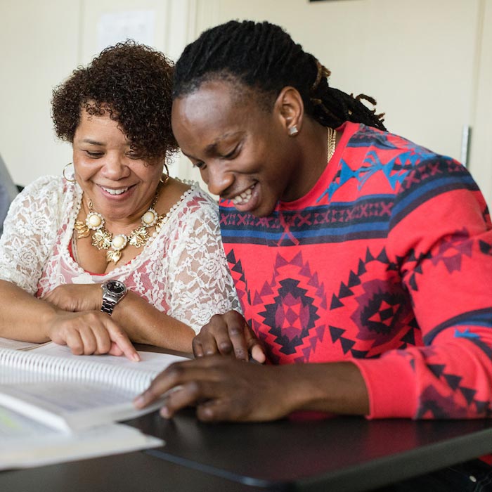 Two counseling students working on assignment in class