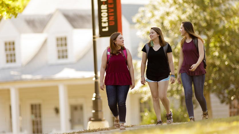 Students walking on sidewalk to class