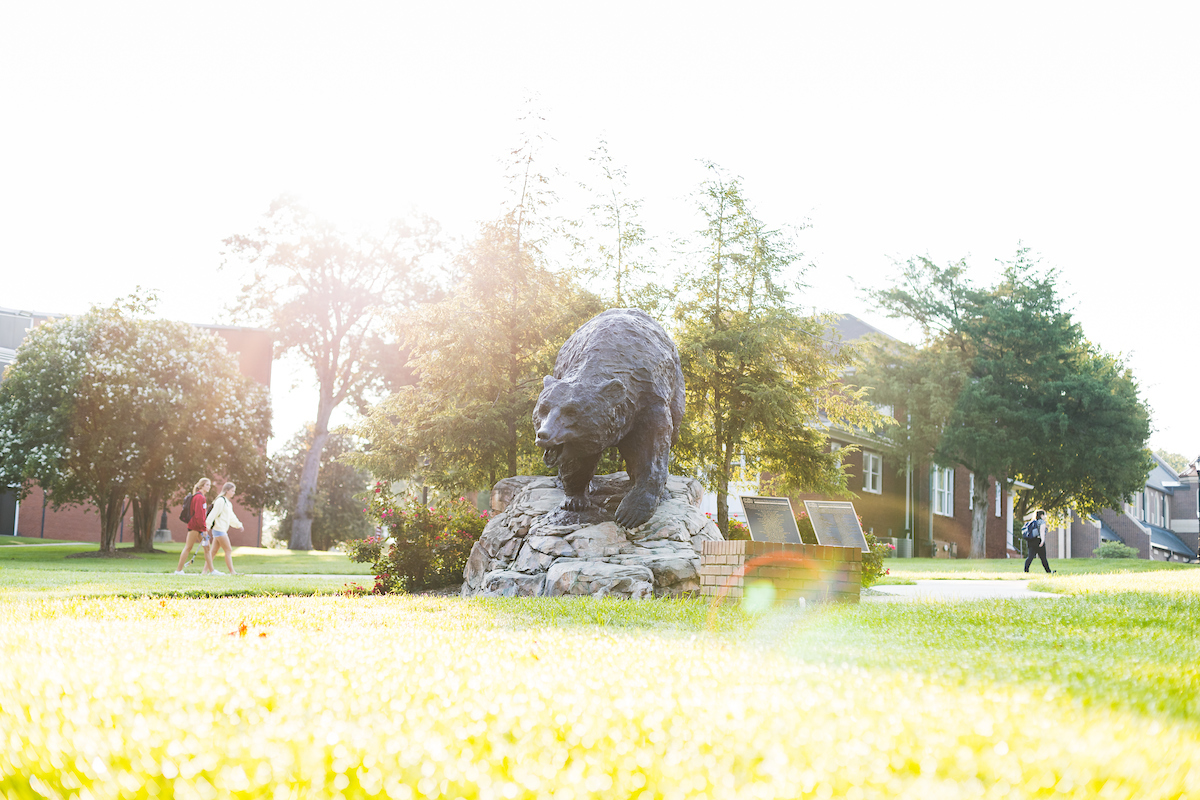 The Charge bear statue, located on campus, is seen in the early morning light