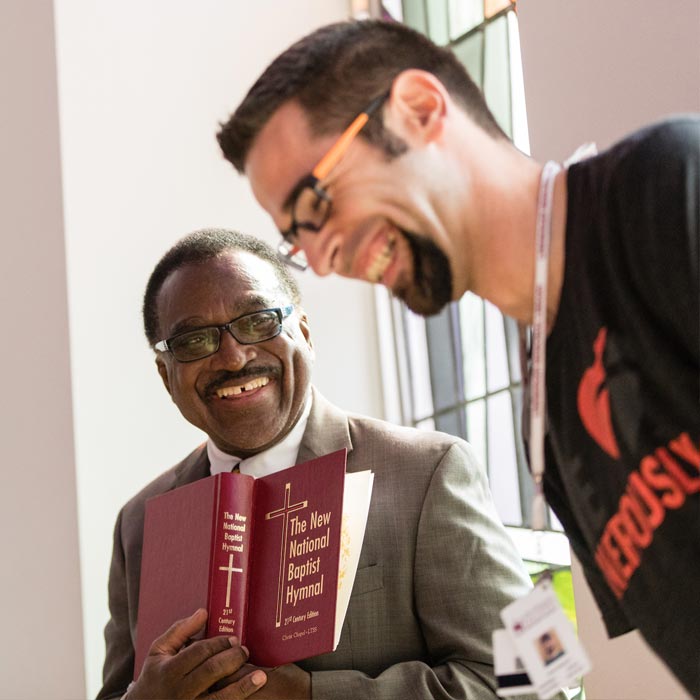 LTSS professor and student share a laugh during a conversation