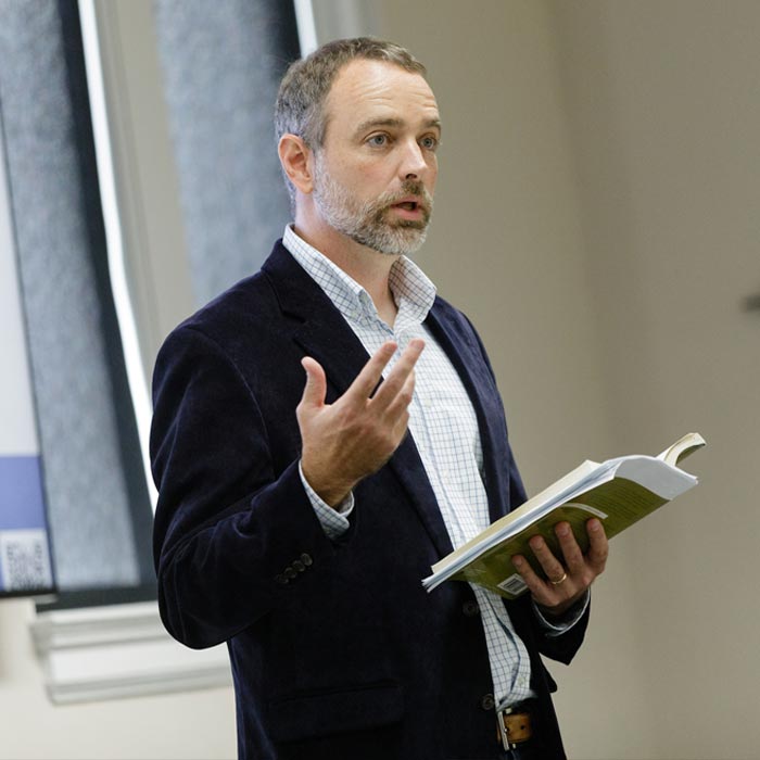 A LTSS professor lectures to students in class