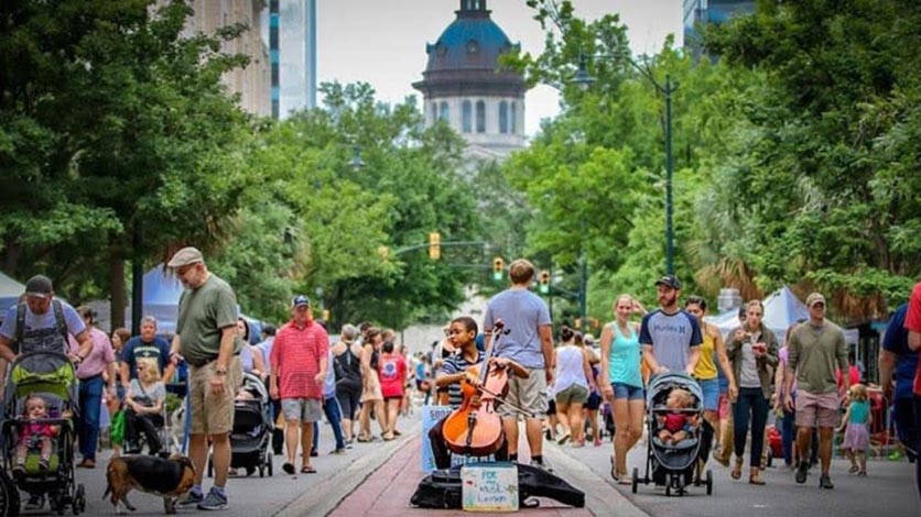 People walking through street fair in Columbia