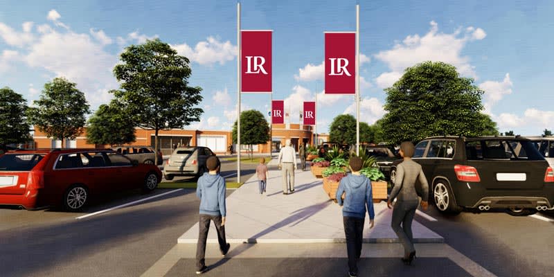 LR Bears fans walk along a rendering of Champions Walk with LR banners flying