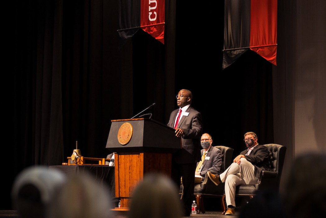 Avery Staley addresses first-year students during the matriculation ceremony indoors.
