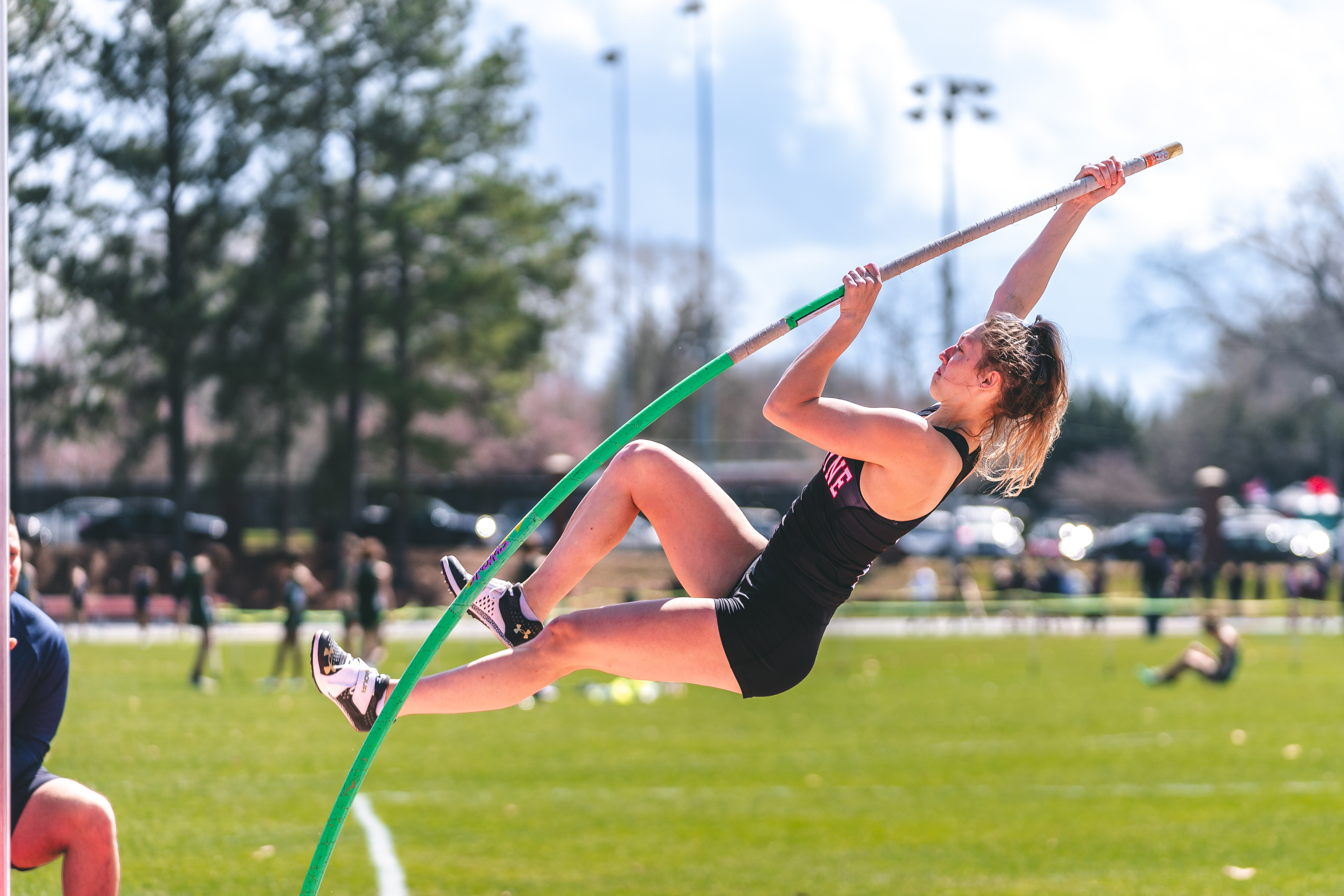 Lacey Triplett prepares to pole vault during an outdoor meet