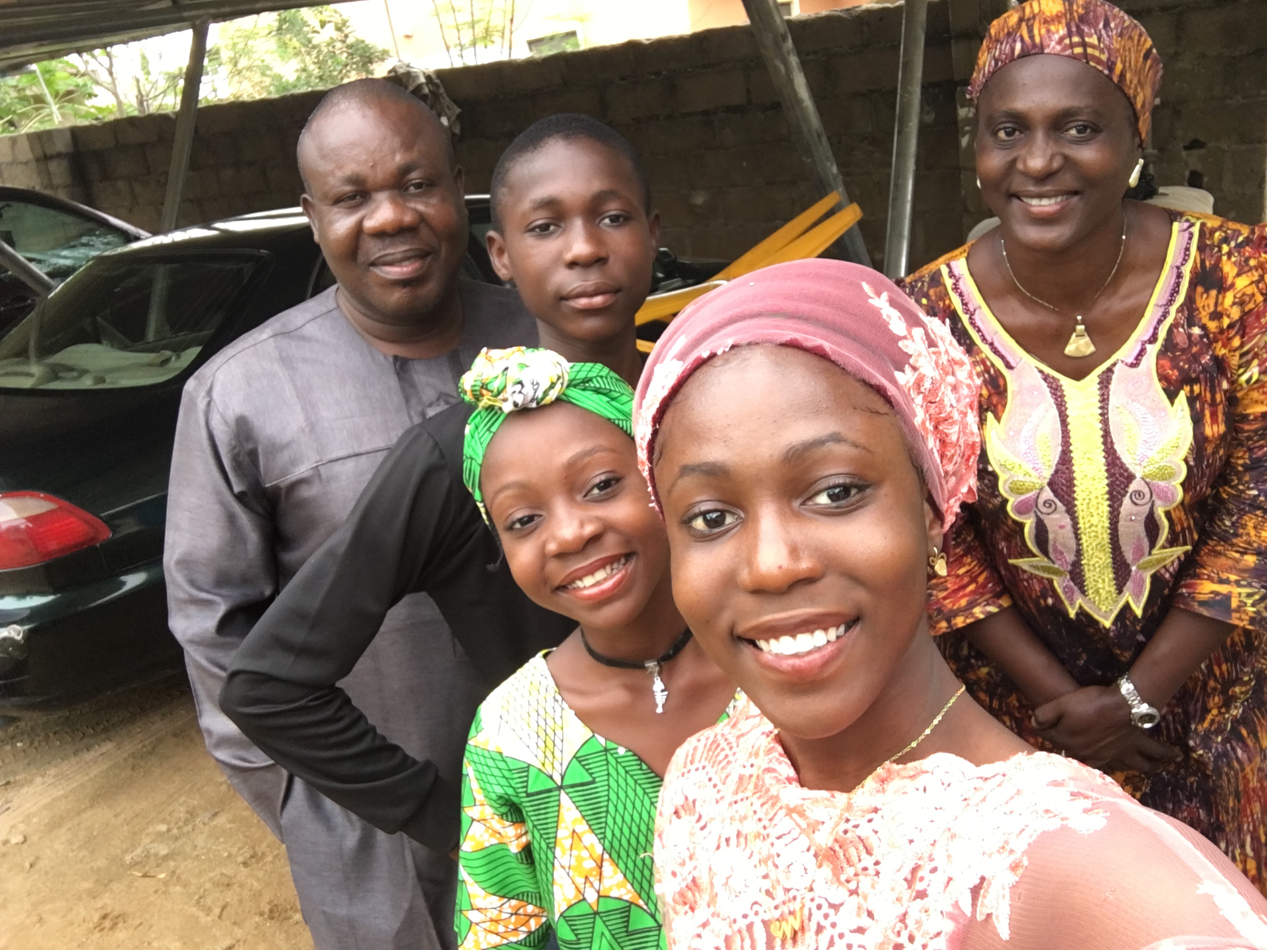 Beulah Yusuf, front right, takes a selfie with her family