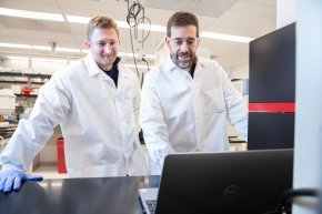 Jacob Stuckey (left) and Gregg Chenail work together in a lab