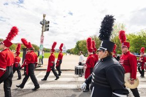 Marching band crosses Mall with Capitol in background