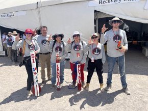 Rocket team making sign of the bear at Spaceport America