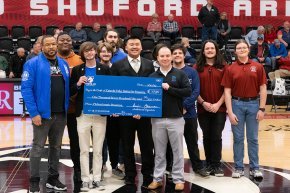 Theta Xi members present check to Habitat for Humanity of Catawba Valley