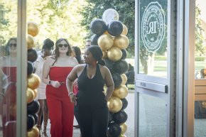 Students arrive in PE Monroe auditorium for the Student Life Awards