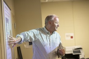 Bjarne Berg teaching in front of a screen in a classroom