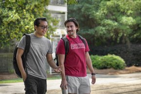 Lai Hnin walks across campus with a friend