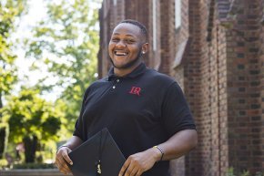 Dylan Foster stands in front of Mauney Hall