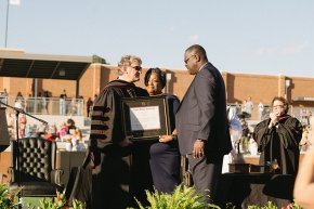 Omari Alexander's parents accept a posthumous bachelor's degree on behalf of their son