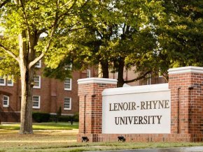 View of entrance to campus and university sign