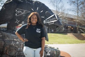 Zaniya Parks wears a Bears Give Back t-shirt in front of the charge