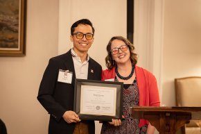 Thinh Truong receives his alumni award from Katie Wohlman
