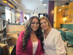 Lina San Juan Martinez with her host mom in a cafe in Spain