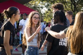 Students greeting each other at the 2024 president's cookout