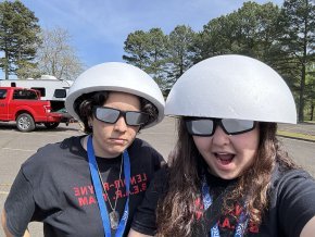 Demmi Ramos and Christina Fisher wearing helmets and mirrored glasses before eclipse launch