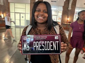 Tanli Carlton displays a custom LR license plate that reads "Ms President"