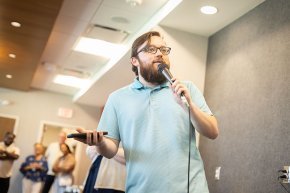Zach Lindler addresses fellow students in Belk Centrum during First Week