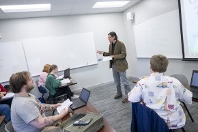 Michael Deckard addresses a classroom of students