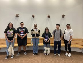 LR students with a display of indigenous-style masks by Tishara Sneed at the Made in the Mountains Symposium