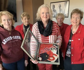 Harriet, Anna, Lura, Caroline and Martha with a shadowbox of DR Mauney's memorabilia