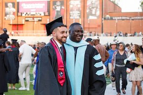 Harry Titus with a student at commencement 2025