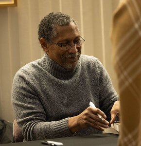 Percival Everett signing books at the Visiting Writers Series