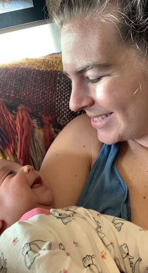 Alyssa Sack holds her smiling daughter Abigail