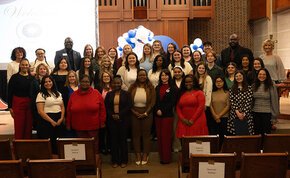 The full class of 2026 Tri-Alpha inductees at the front of Grace Chapel