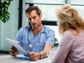 Nurse practitioner talking with patient