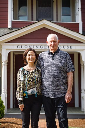 Karen Higo and husband Jim Wagoner in front of Cloninger House