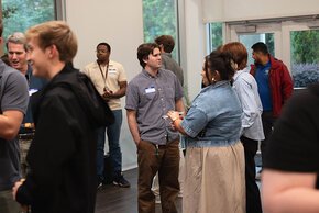 Students and employers talking to each other at a reception