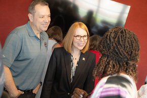 Glenn and Summer McGee greet a student in the presidental suite in Moretz Stadium