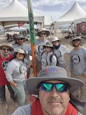 Selfie of rocket team at IREC 2926 with advisor Doug Knight in foreground