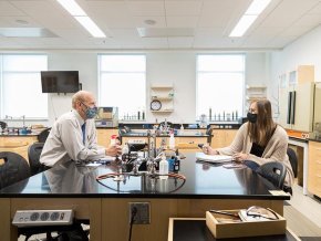 Dr. Daniel Grimm talks with a student.