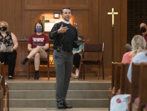 Pastor Todd preaches a sermon inside Grace Chapel to students, faculty and staff