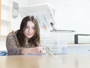 Maggie Keller sits in a lab