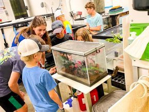 Becca Fox works with young students in aquatics lab